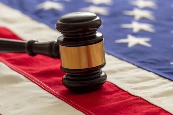 Justice in USA Law gavel on United States of America flag