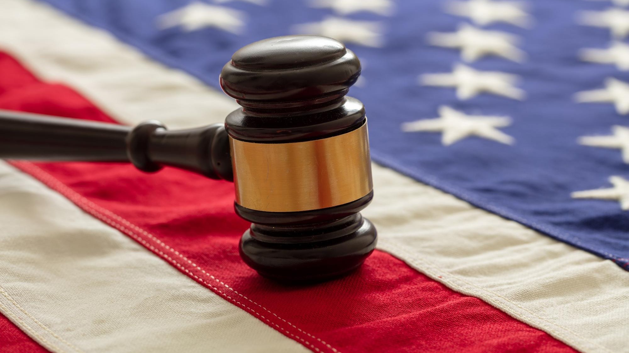 Justice in USA Law gavel on United States of America flag