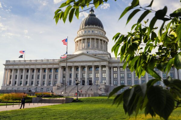 Capitol building with green trees and blue sky