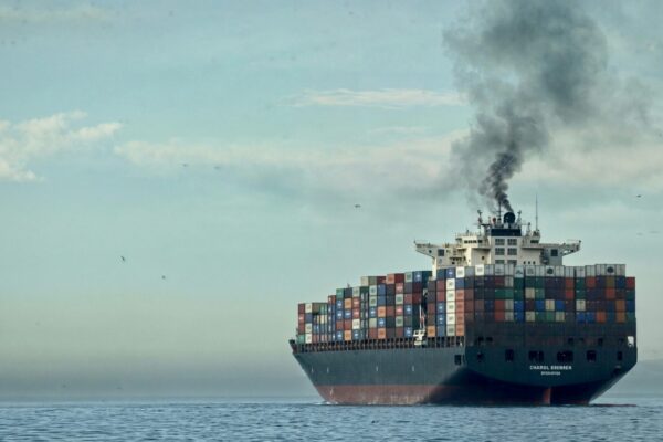 a large cargo ship in the middle of the ocean