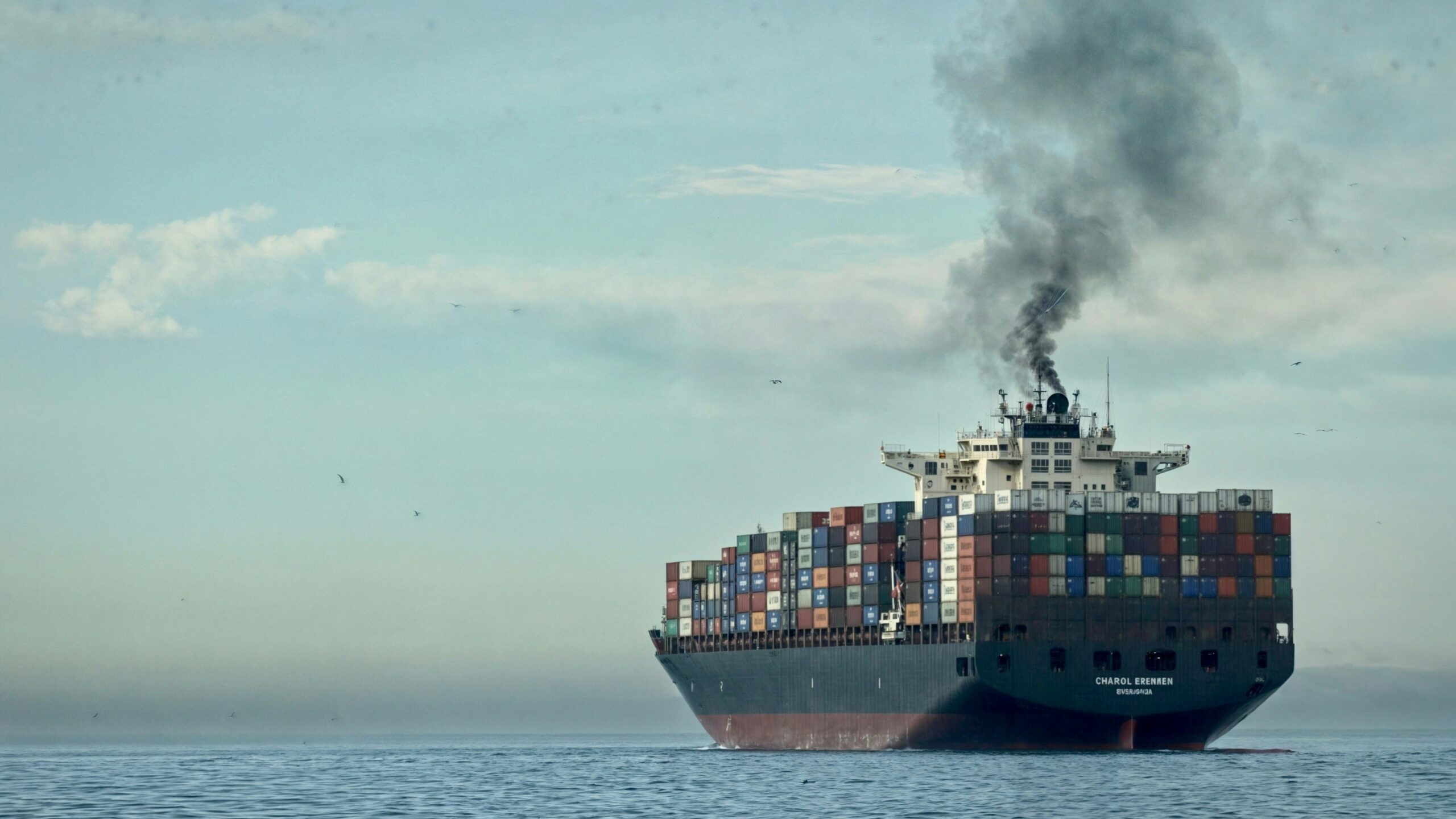 a large cargo ship in the middle of the ocean
