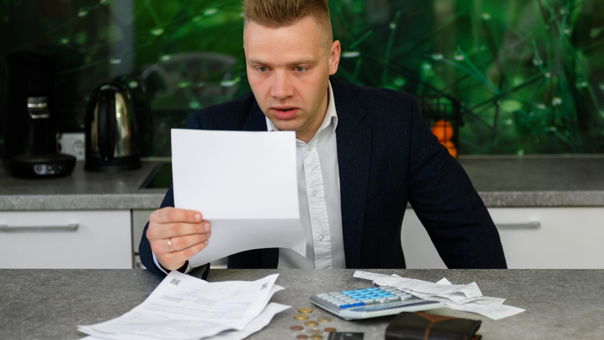 Man reading notice regarding late payments