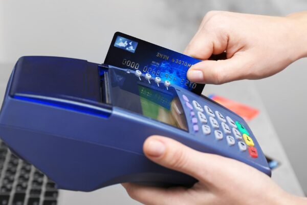 Hands using bank terminal for credit card payment