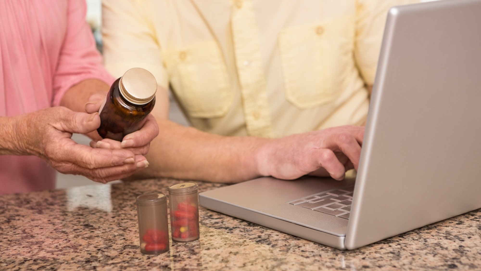 Senior couple looking up medication online