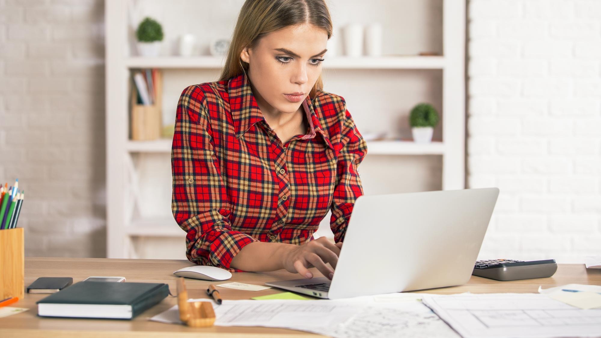 Female using laptop at desk