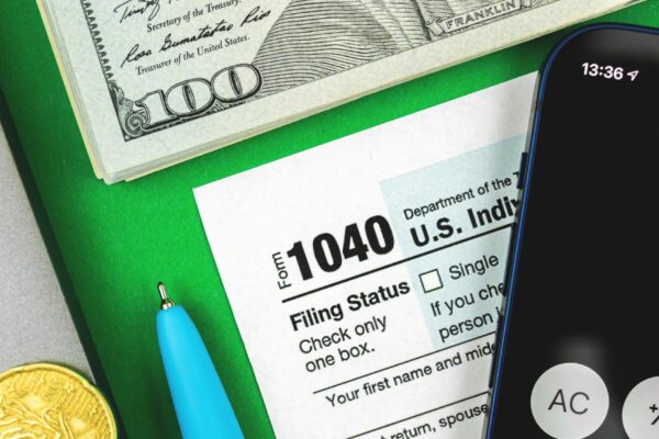 Business and financial concept with tax form 1040 desktop background closeup