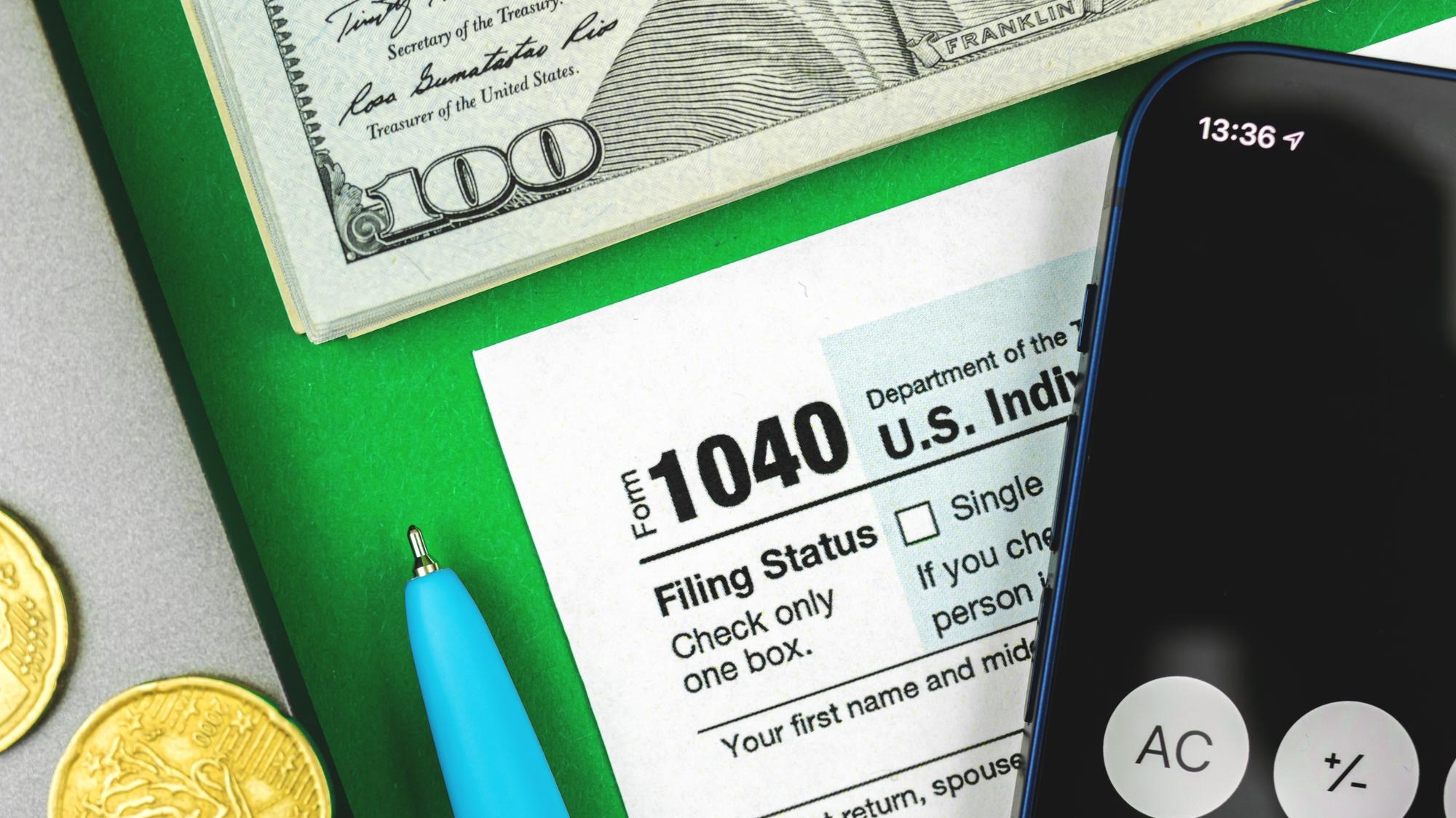 Business and financial concept with tax form 1040 desktop background closeup