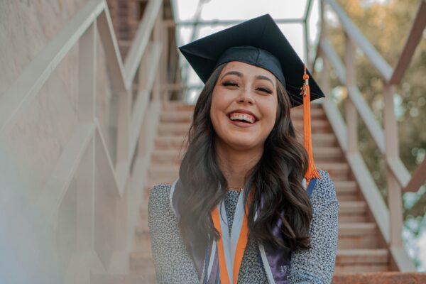 a woman wearing a graduation cap and gown