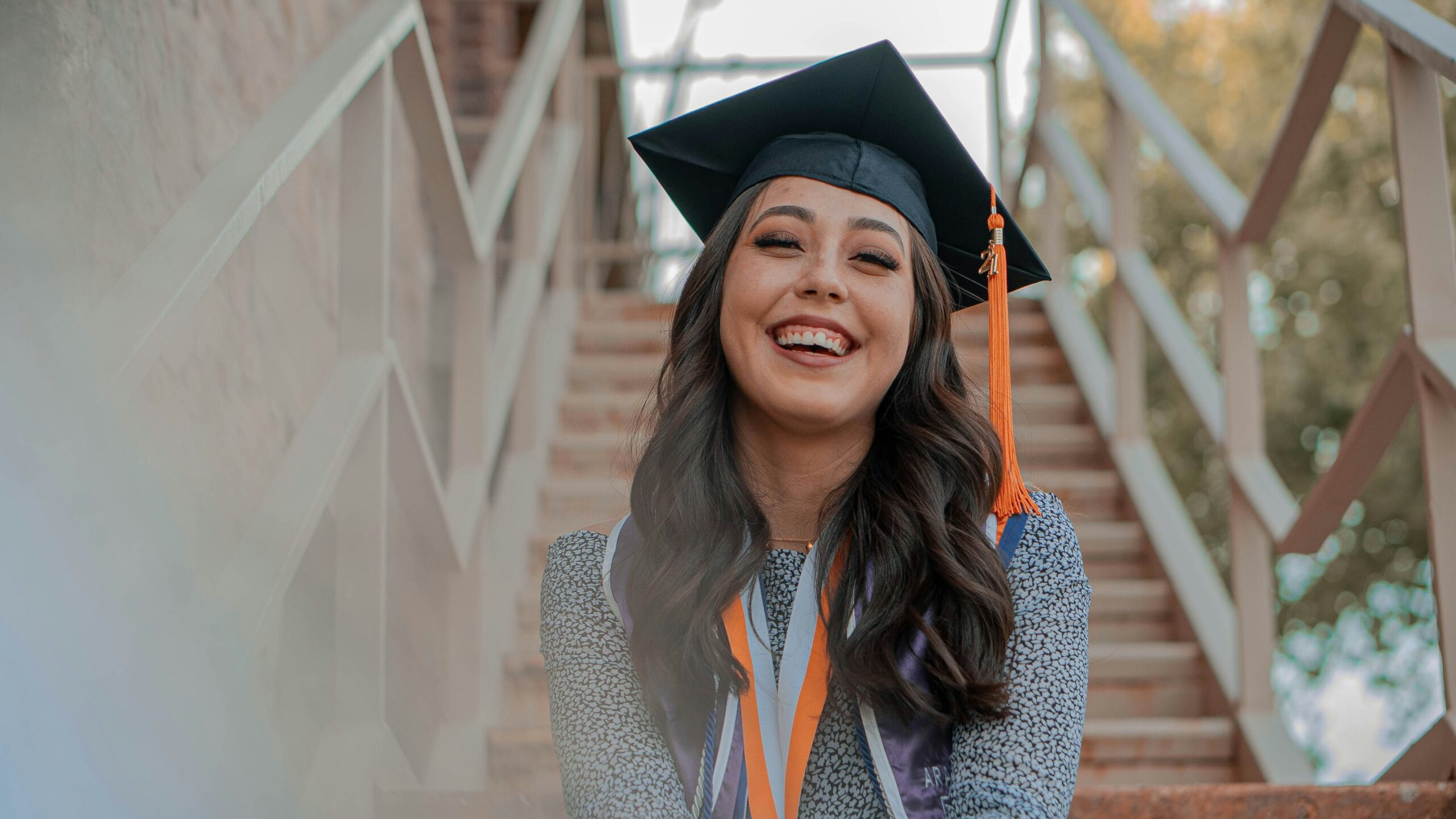 a woman wearing a graduation cap and gown