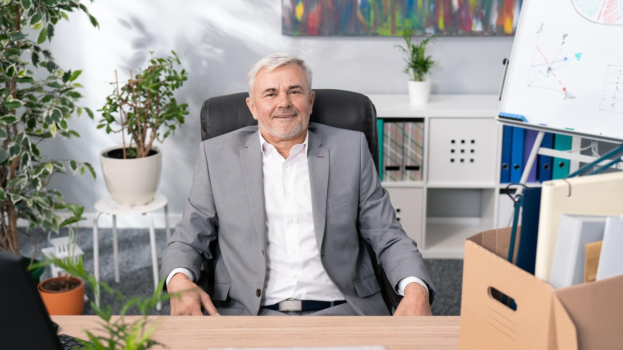 Sympathetic handsome older man boss manager of company