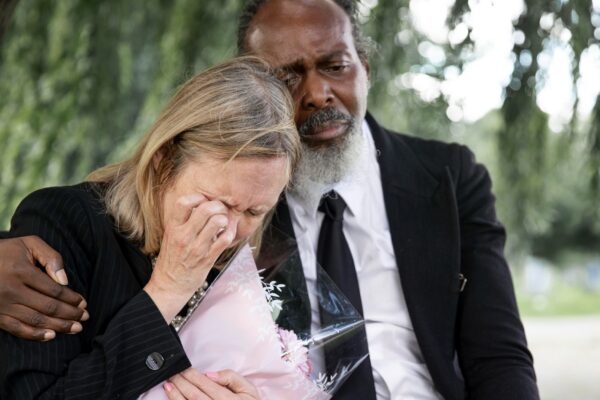 Family visiting grave of loved one