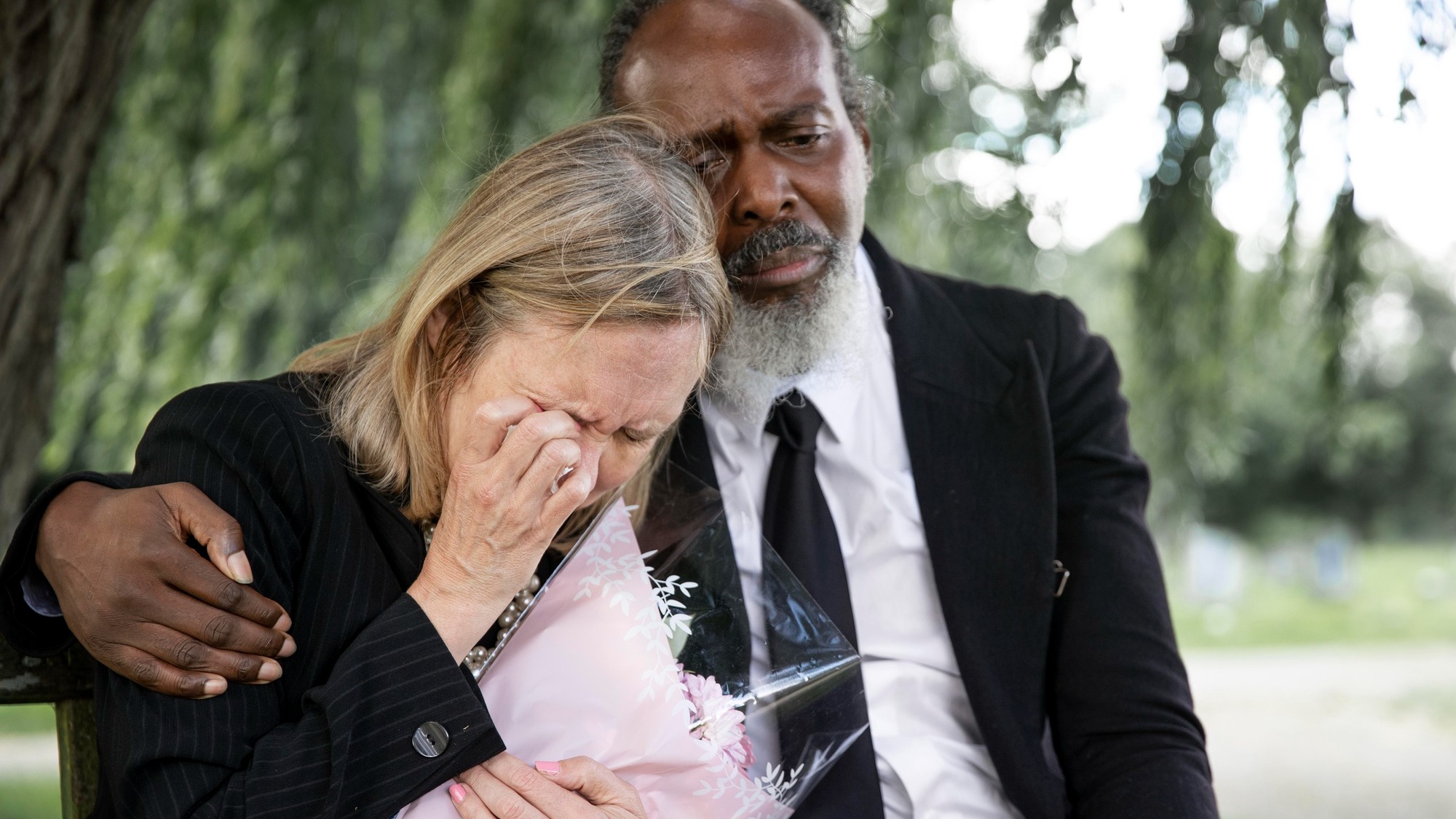 Family visiting grave of loved one
