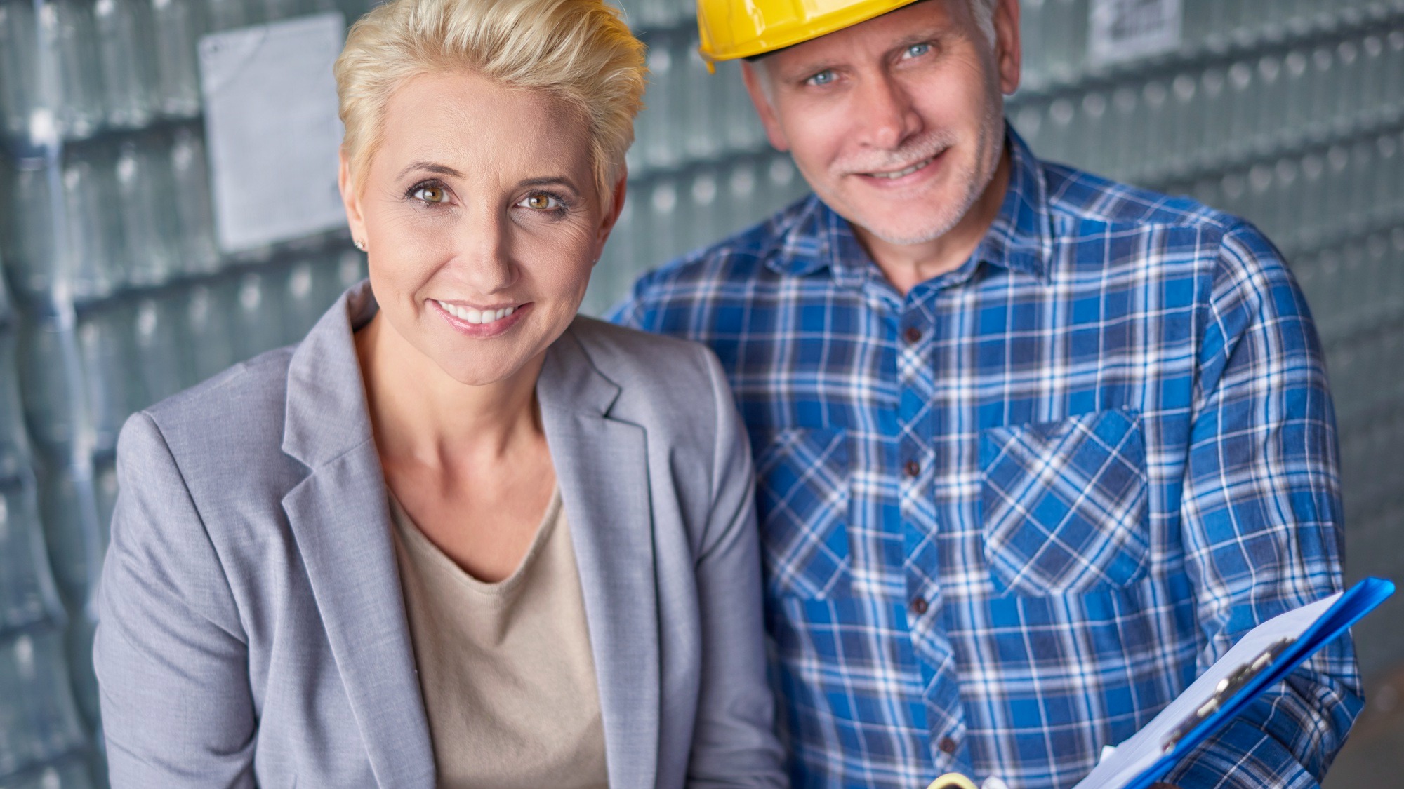 Two people working in warehouse