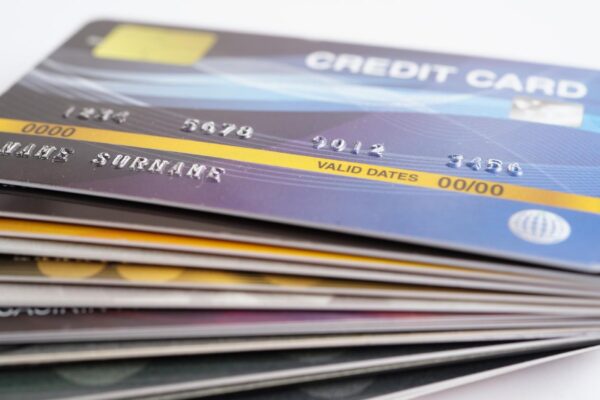 Credit card and magnifying glass for online shopping security finance business concept