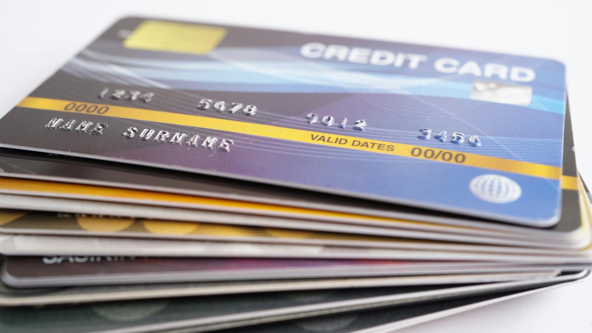 Credit card and magnifying glass for online shopping security finance business concept