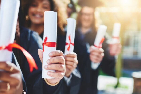 Graduation hands and students with certificate at college with education opportunity or achievement University friends and group of people at campus event with knowledge scholarship and diploma