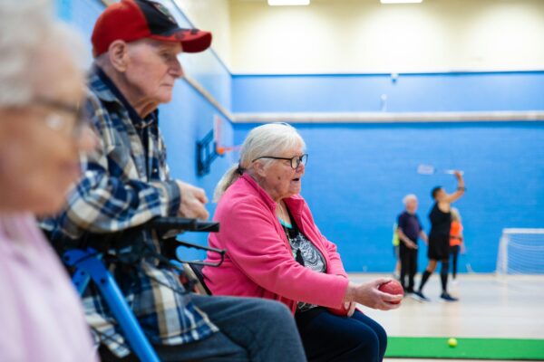 Seniors playing a game in a gymnasium.