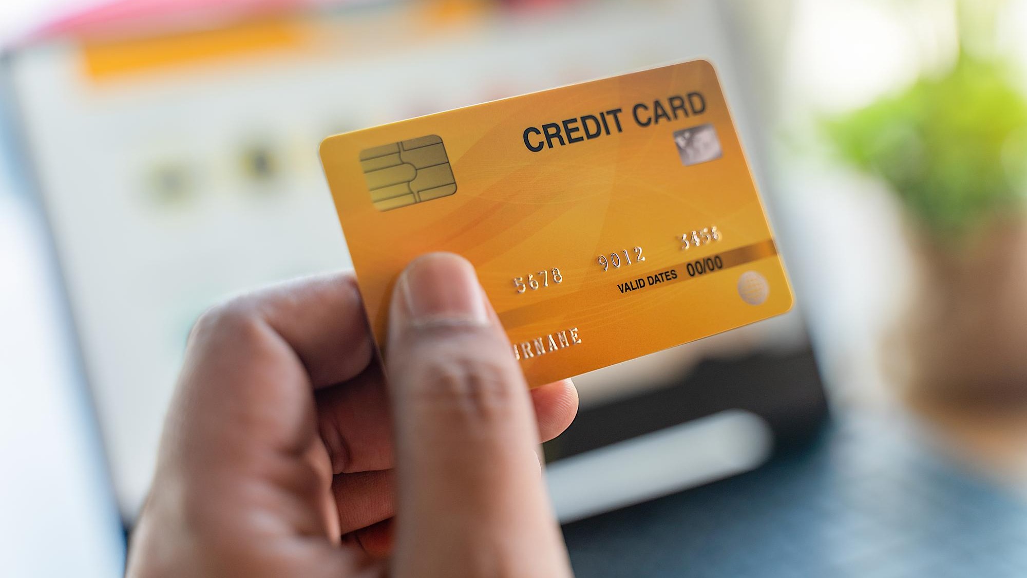Close-up of hand holding credit card