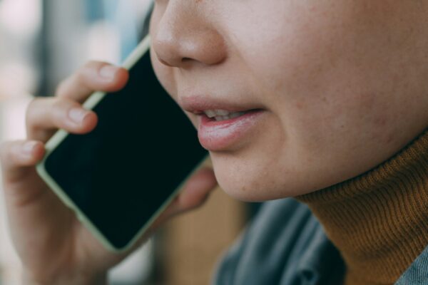 A woman is talking on a cell phone