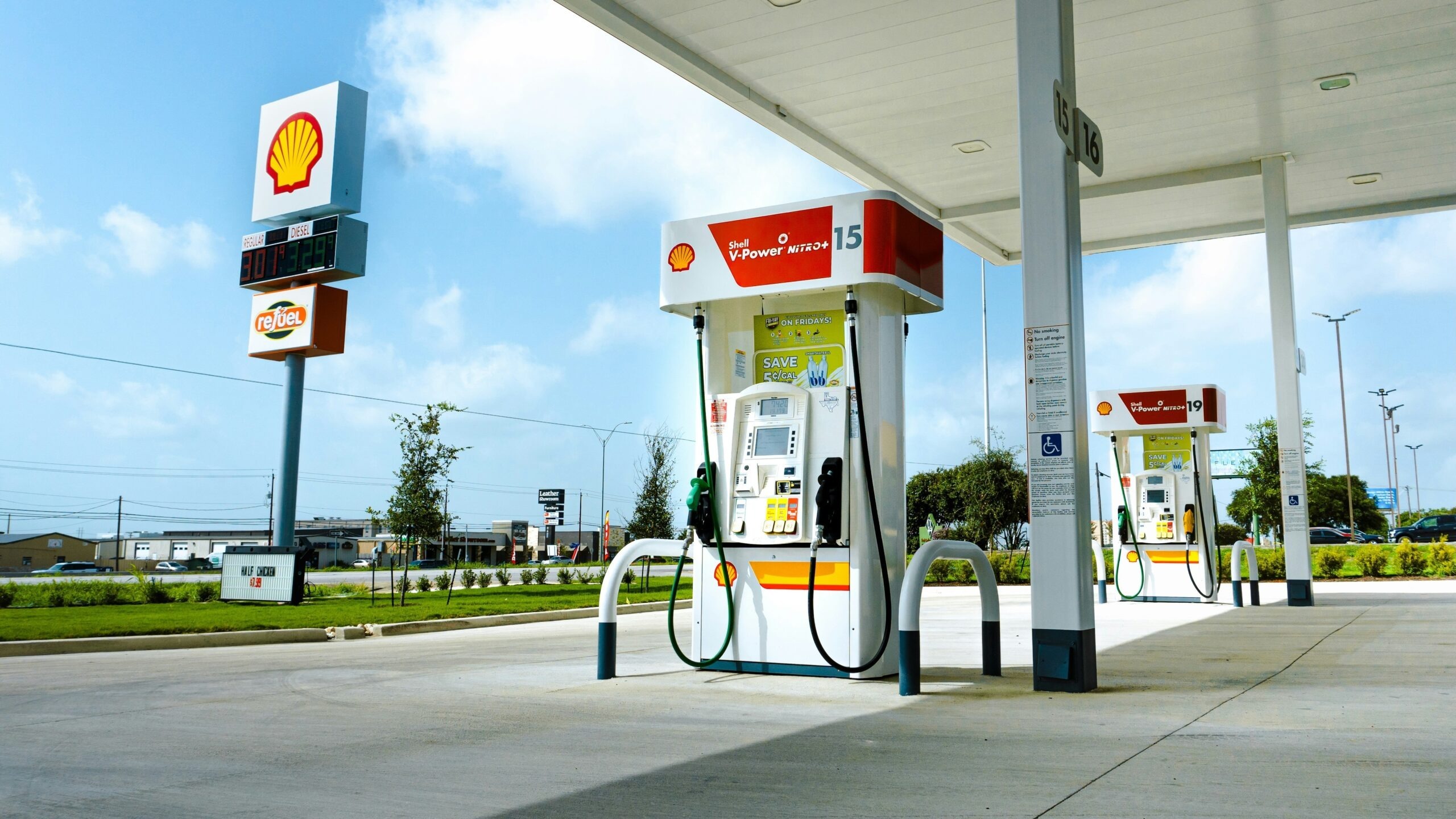 A gas station with a few gas pumps