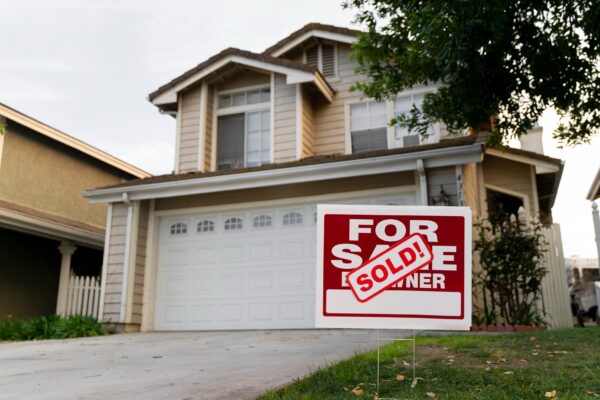 House with sold yard sign