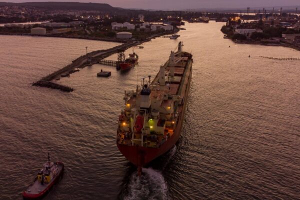 Bulk carrier cargo ship enters the port for unloading in the evening