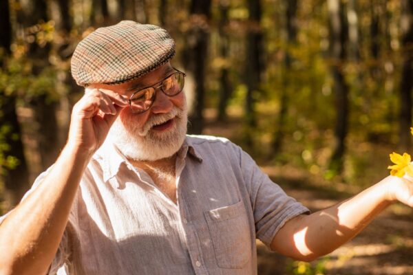 Old age is joy Old age pensioner enjoy autumn nature Old man collect yellow leaves Old person with grey beard hair Pension and retirement Leisure and lifestyle Adventure awaits