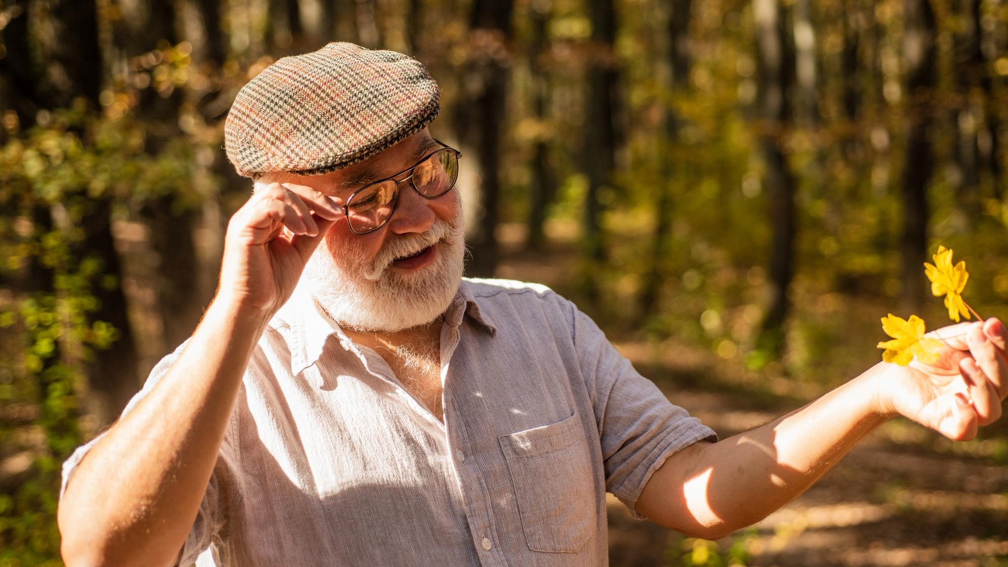 Old age is joy Old age pensioner enjoy autumn nature Old man collect yellow leaves Old person with grey beard hair Pension and retirement Leisure and lifestyle Adventure awaits