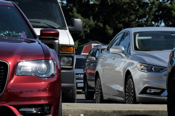 a parking lot filled with lots of parked cars