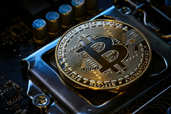 a bitcoin on top of a computer motherboard