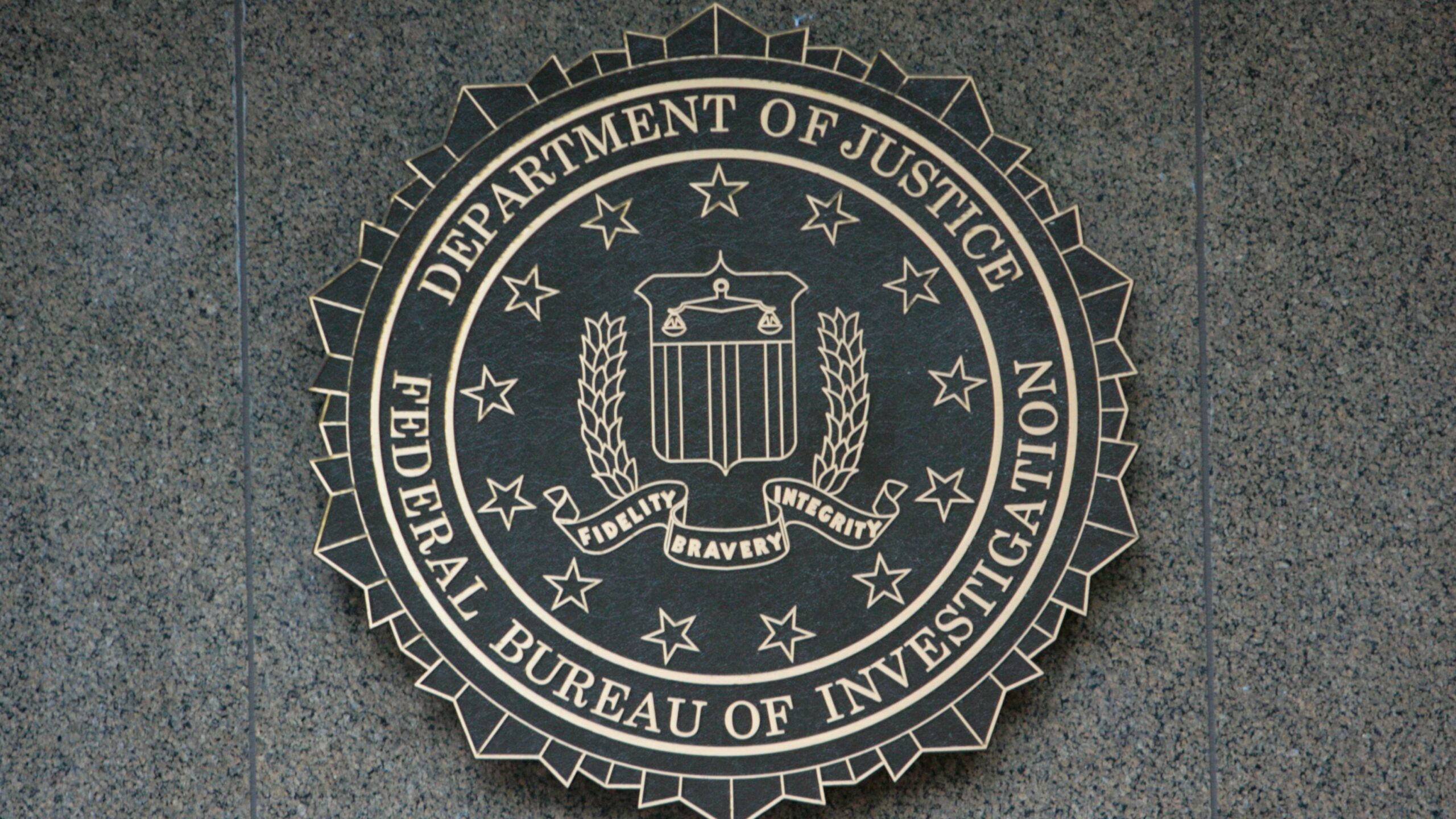 the seal of the department of justice on a wall