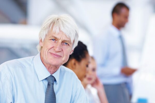 Portrait business people and man in meeting startup and confidence with manager teamwork and planning Face group and employees in office cooperation and discussion for project idea or proposal
