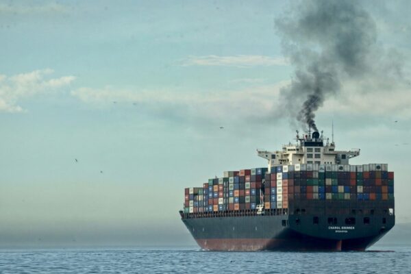 a large cargo ship in the middle of the ocean