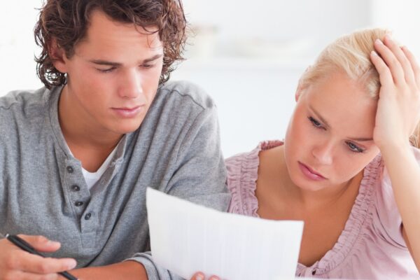 Worried Couple with Paperwork