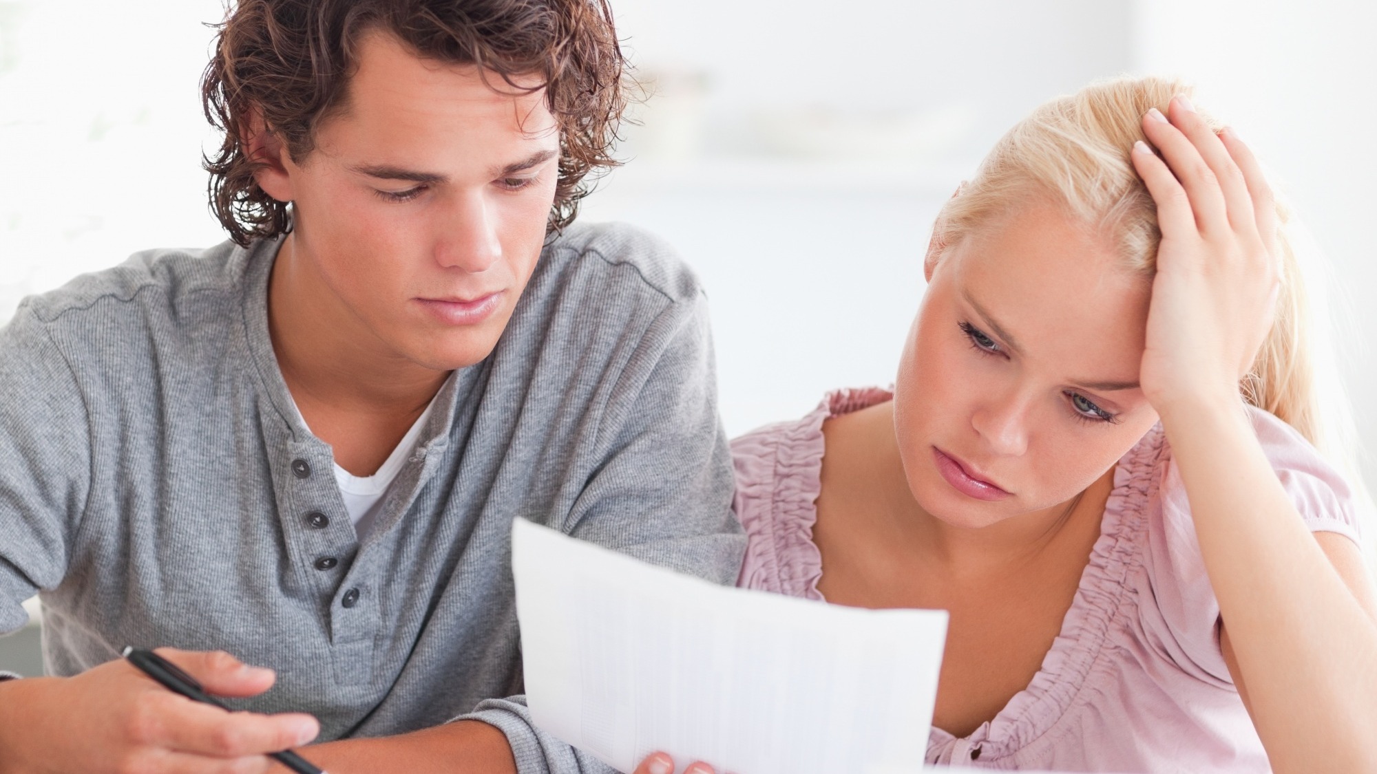 Worried Couple with Paperwork