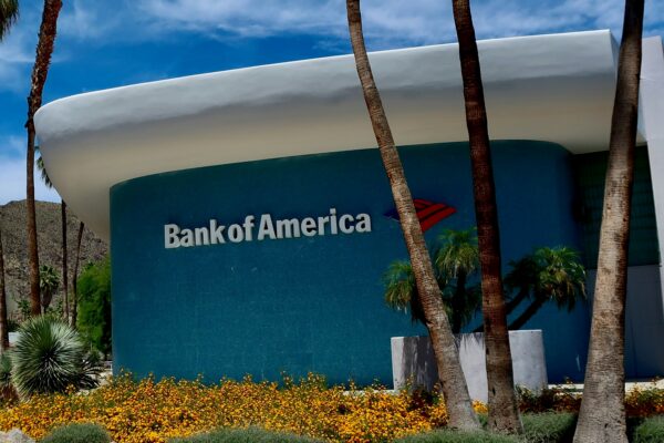 a bank of america building with palm trees in front of it