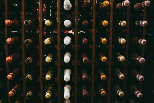 assorted wine bottle on racks