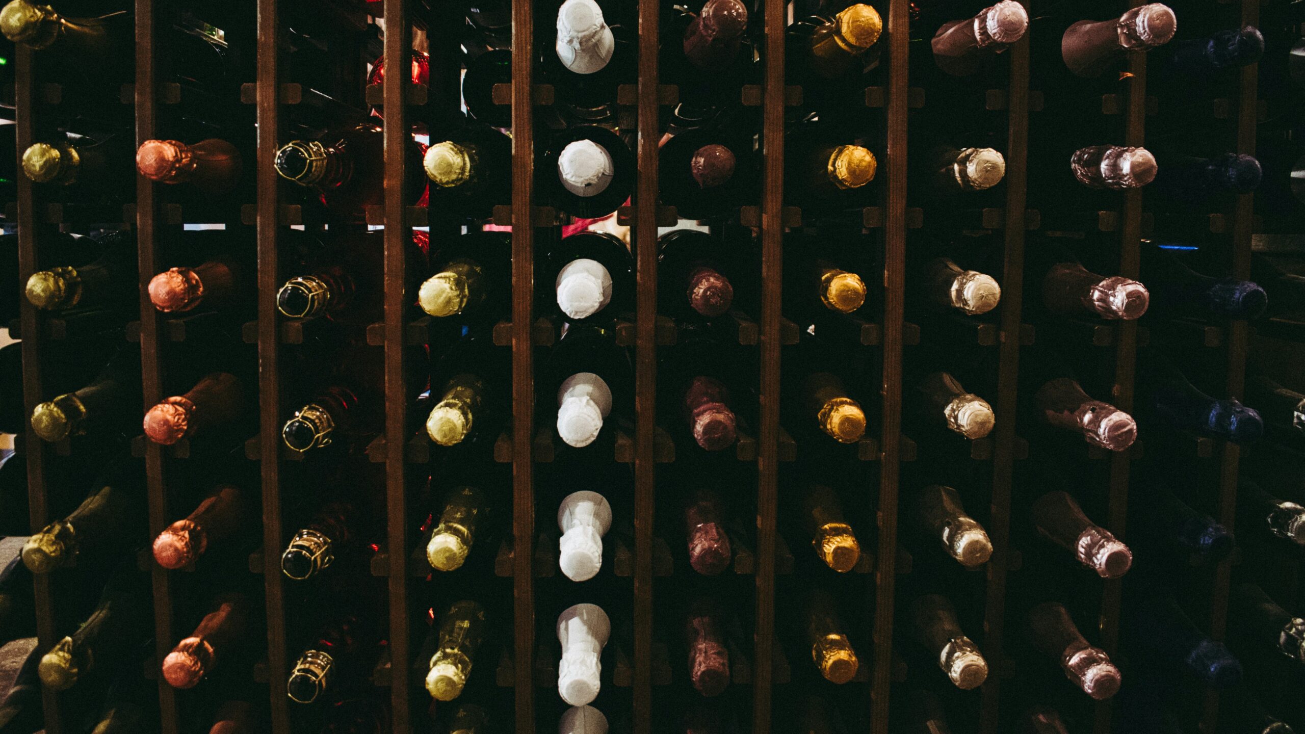 assorted wine bottle on racks
