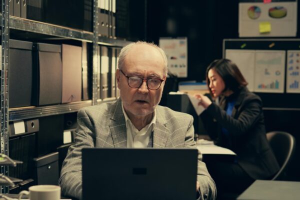 Senior law agent examining financial records to find account information