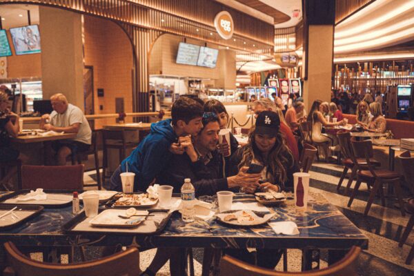 a group of people sitting at a table in a restaurant