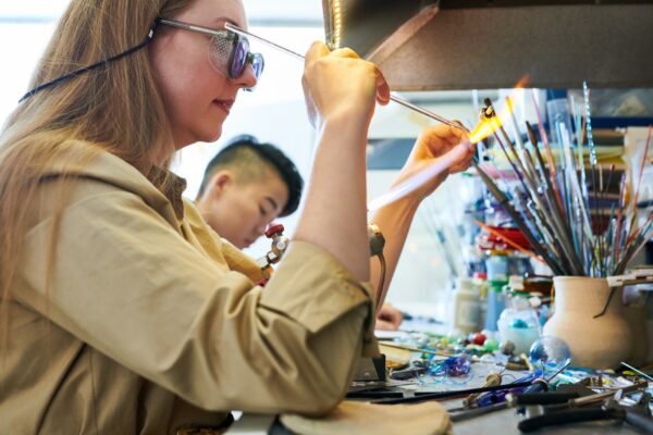 Artist Shaping Glass in Flame