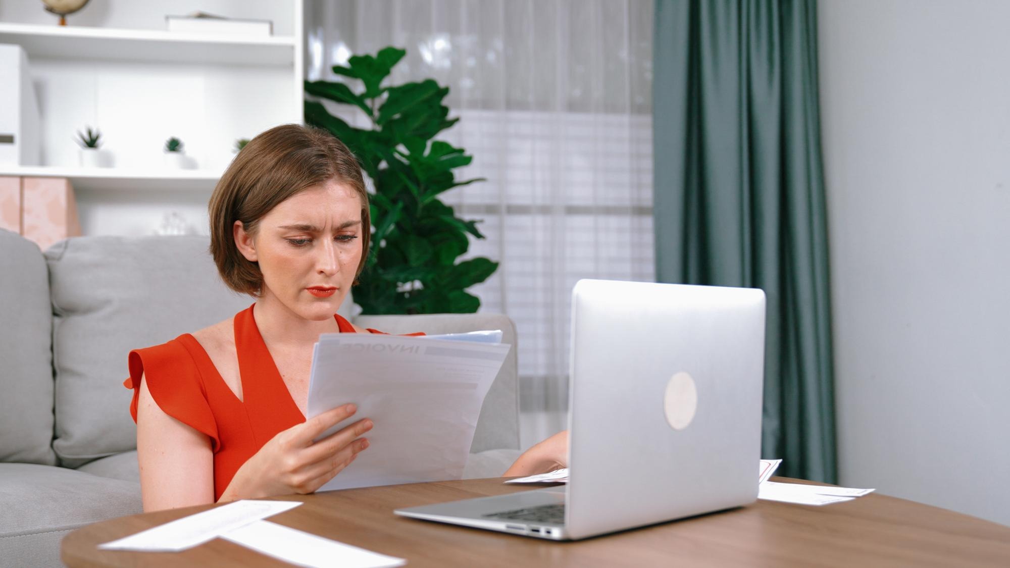 Stressed young woman has financial problems credit card debt to pay Prim