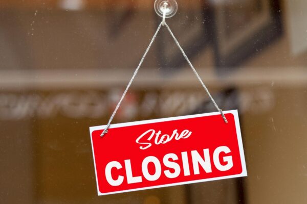 Store closing sign on a window