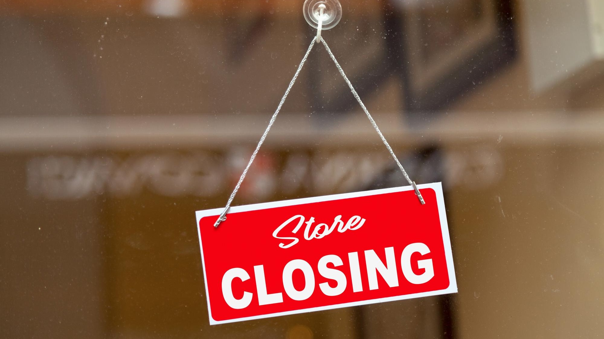 Store closing sign on a window