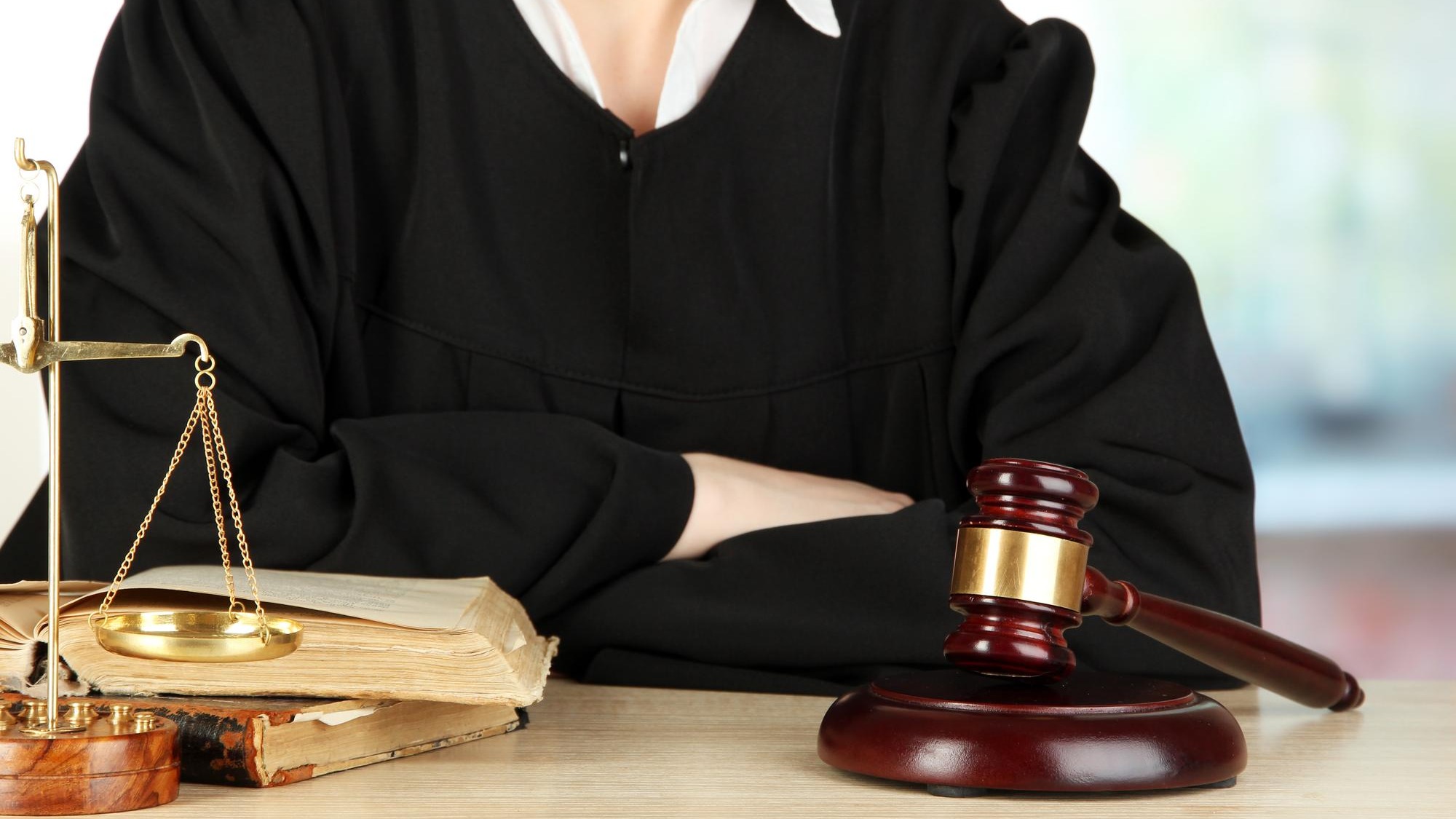 Judge sitting at table during court hearings on room background