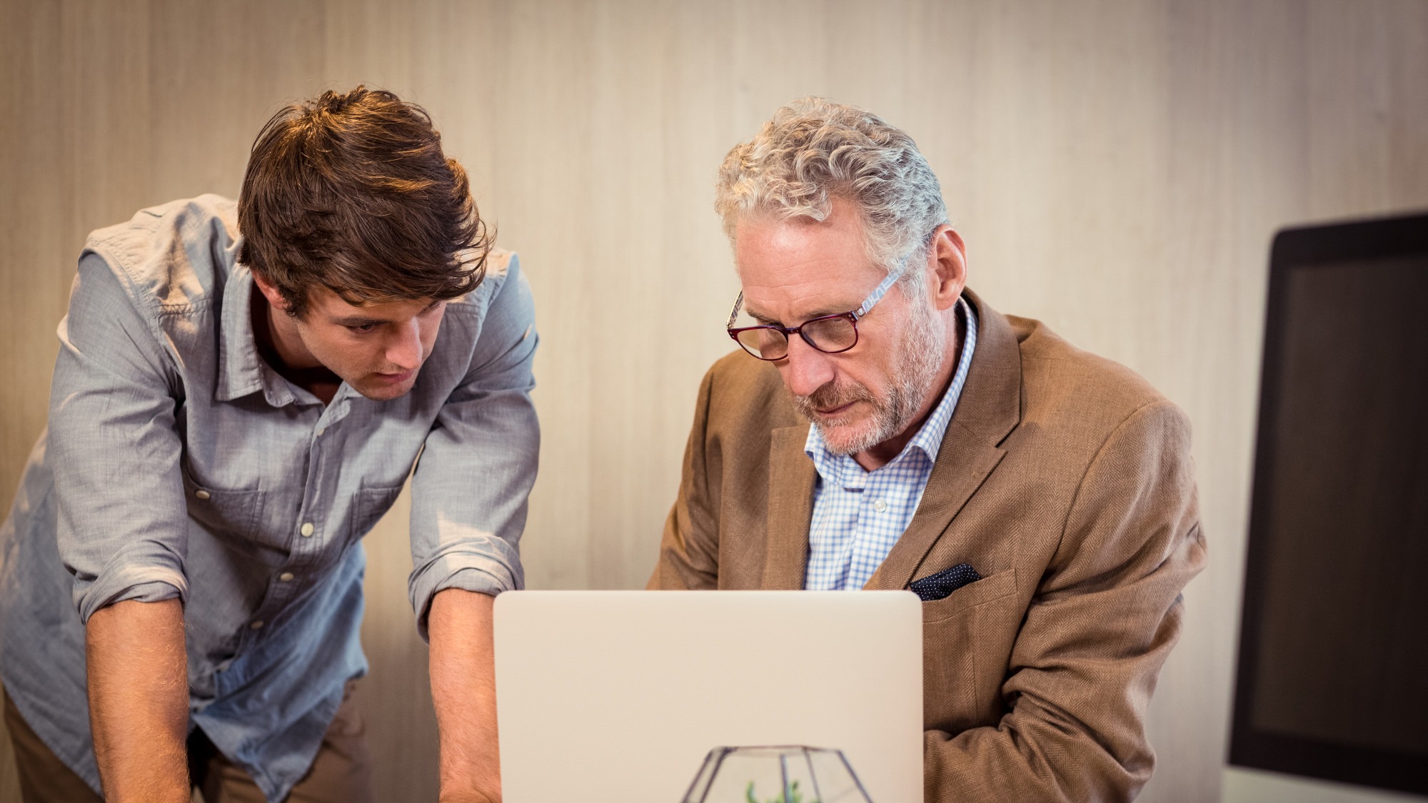 Businessmen working on laptop