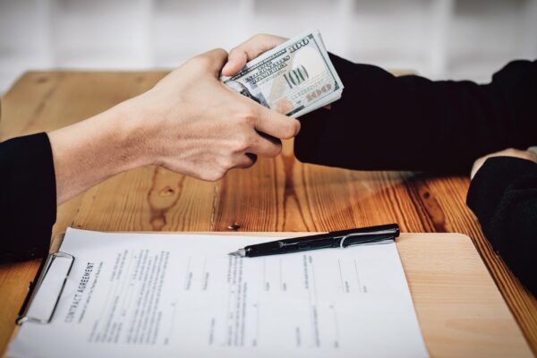 Corrupt concept corrupt private entrepreneurs are handing over money to government employees to offer to sign contracts that benefit their company