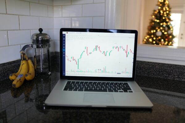 macbook pro on black table