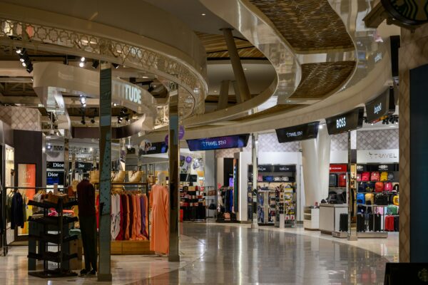 A bright and modern shopping mall interior.