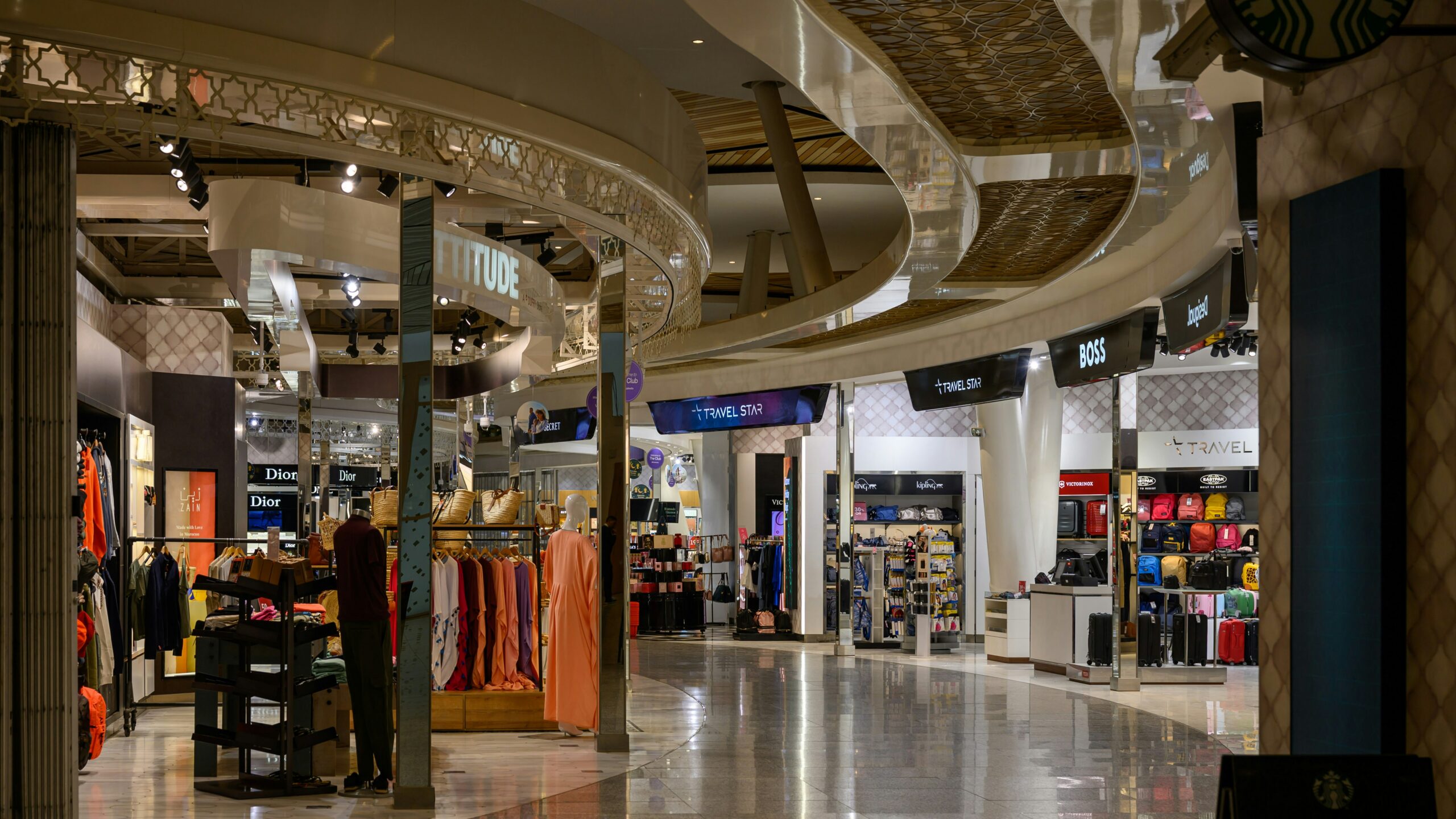 A bright and modern shopping mall interior.
